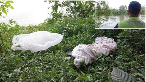 homem-e-encontrado-morto-em-rio-1 A vítima deixou seus pertence na beira do rio - Foto: Fabiano Joaquim e Fernando Sombrio/Repórter Sul/Notisul